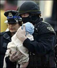 Police carry baby from standoff