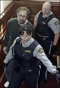 Sheriff escorts Larry Finck