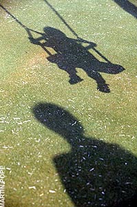 Children playing on swing