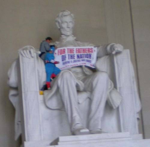 Fathers-4-Justice climb the Lincoln Memorial