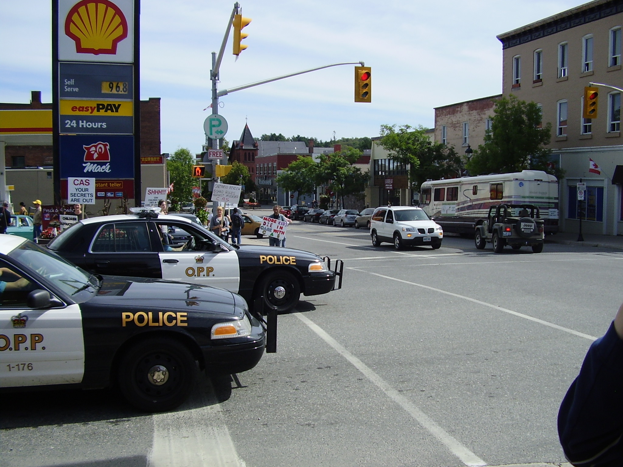 Police cruisers at Huntsville rally for CAS accountability