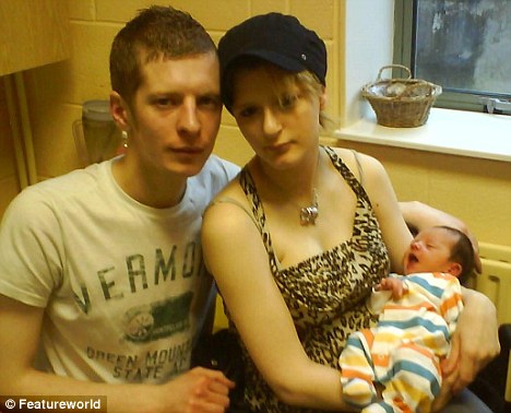 Father Mark McDougall with mother Kerry Robertson and baby Ben