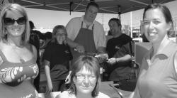 Jennifer Moore and Jacqueline Moore flanking Chris Andrade