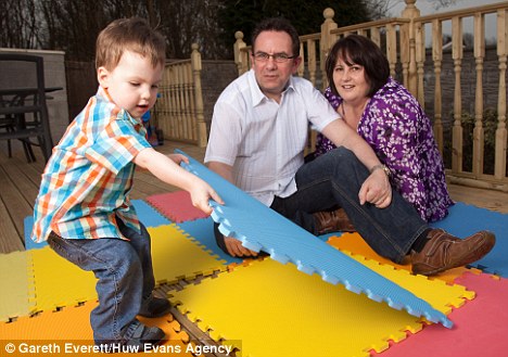 David and Julie Nevin with son