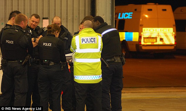 Officers huddle