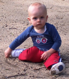 child draws line in the sand