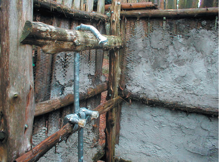 Cold-water showers used by foster children at a therapeutic campsite